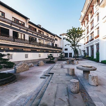 เอทัวร์ โฮเต็ล ไห่หนิง เลทเทอร์ซิตี้ หนานกวนเซียง Hotel Haining ภายนอก รูปภาพ