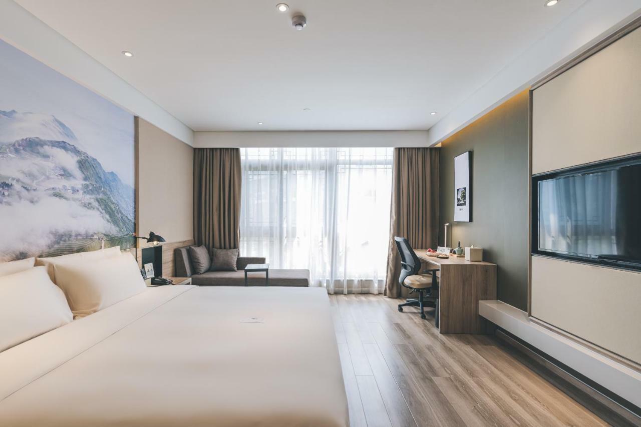 เอทัวร์ โฮเต็ล ไห่หนิง เลทเทอร์ซิตี้ หนานกวนเซียง Hotel Haining ภายนอก รูปภาพ