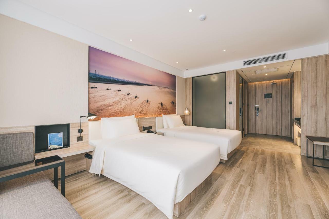 เอทัวร์ โฮเต็ล ไห่หนิง เลทเทอร์ซิตี้ หนานกวนเซียง Hotel Haining ภายนอก รูปภาพ