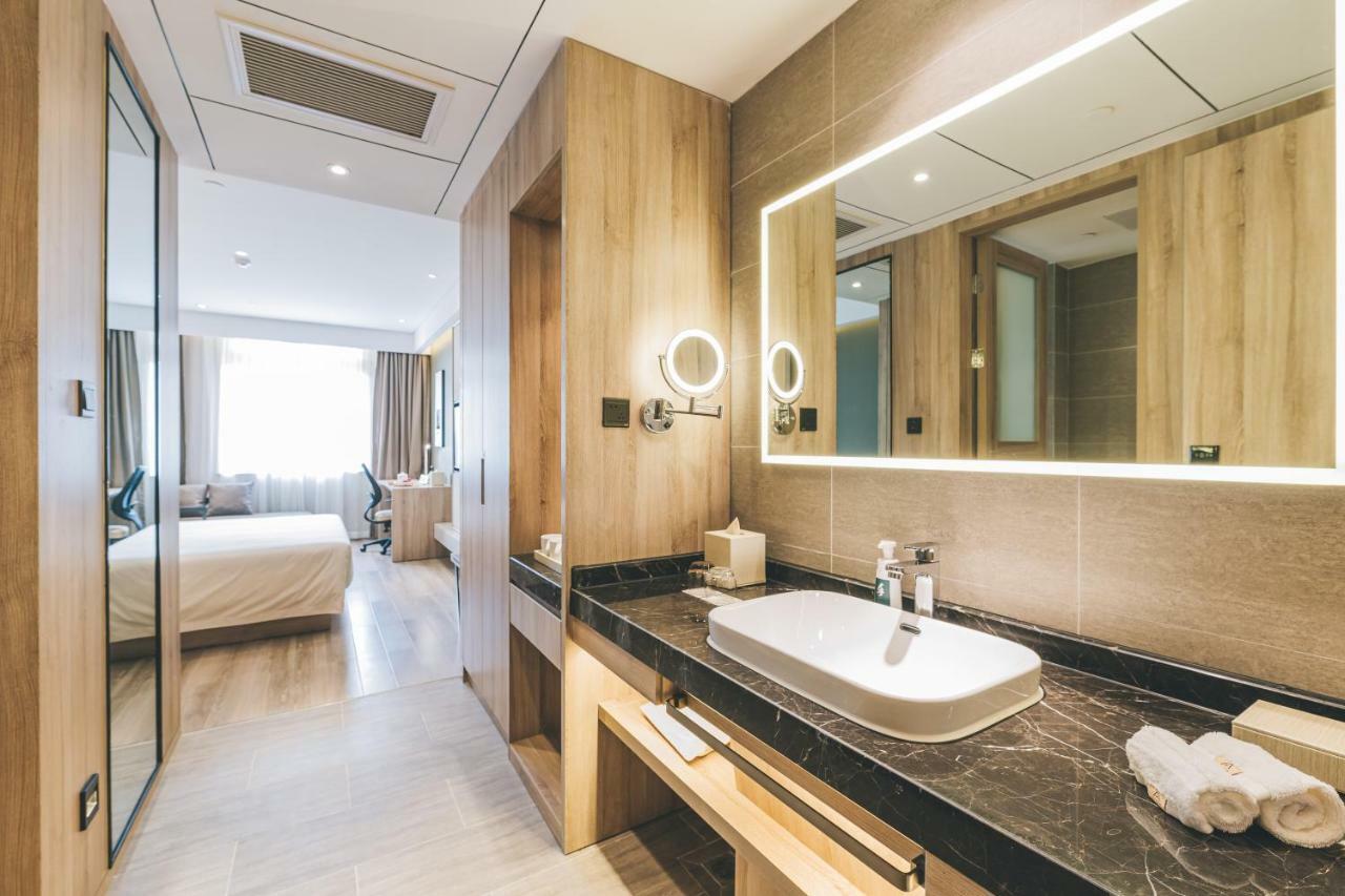 เอทัวร์ โฮเต็ล ไห่หนิง เลทเทอร์ซิตี้ หนานกวนเซียง Hotel Haining ภายนอก รูปภาพ