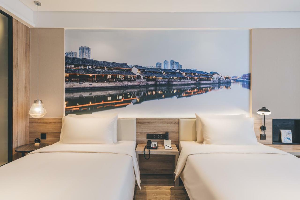 เอทัวร์ โฮเต็ล ไห่หนิง เลทเทอร์ซิตี้ หนานกวนเซียง Hotel Haining ภายนอก รูปภาพ